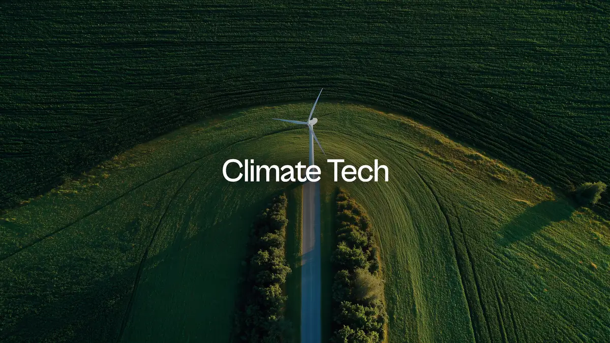 Climate Tech: a wind turbine alone in a sunlit field, seen from above