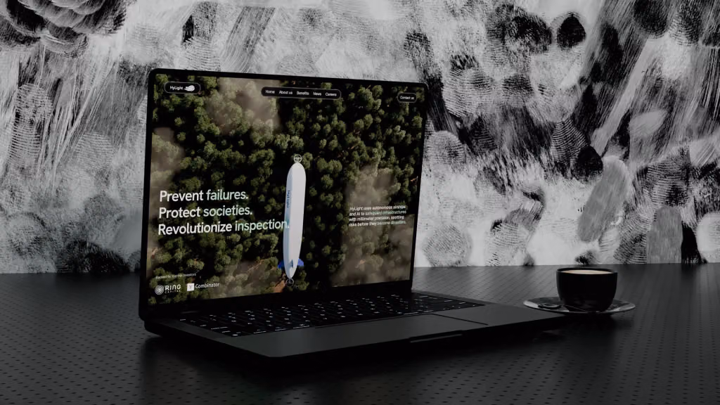The Hylight website open on a laptop: an airship over a forest and the headline “Prevent failures. Protect societies. Revolutionize inspection.”