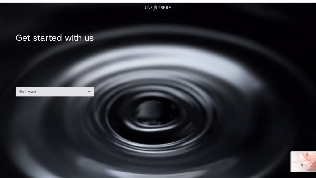Une Autre Île Productions website: “Get started with us” over black and white ripples on water