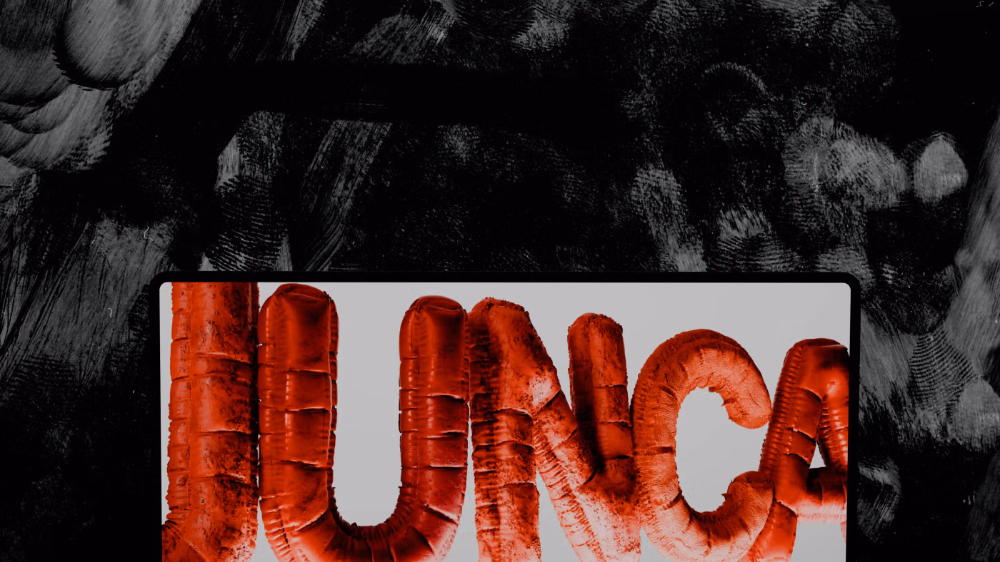 The Junca logo as red inflated 3D letters on a laptop screen, against a black and white brushstroke wall
